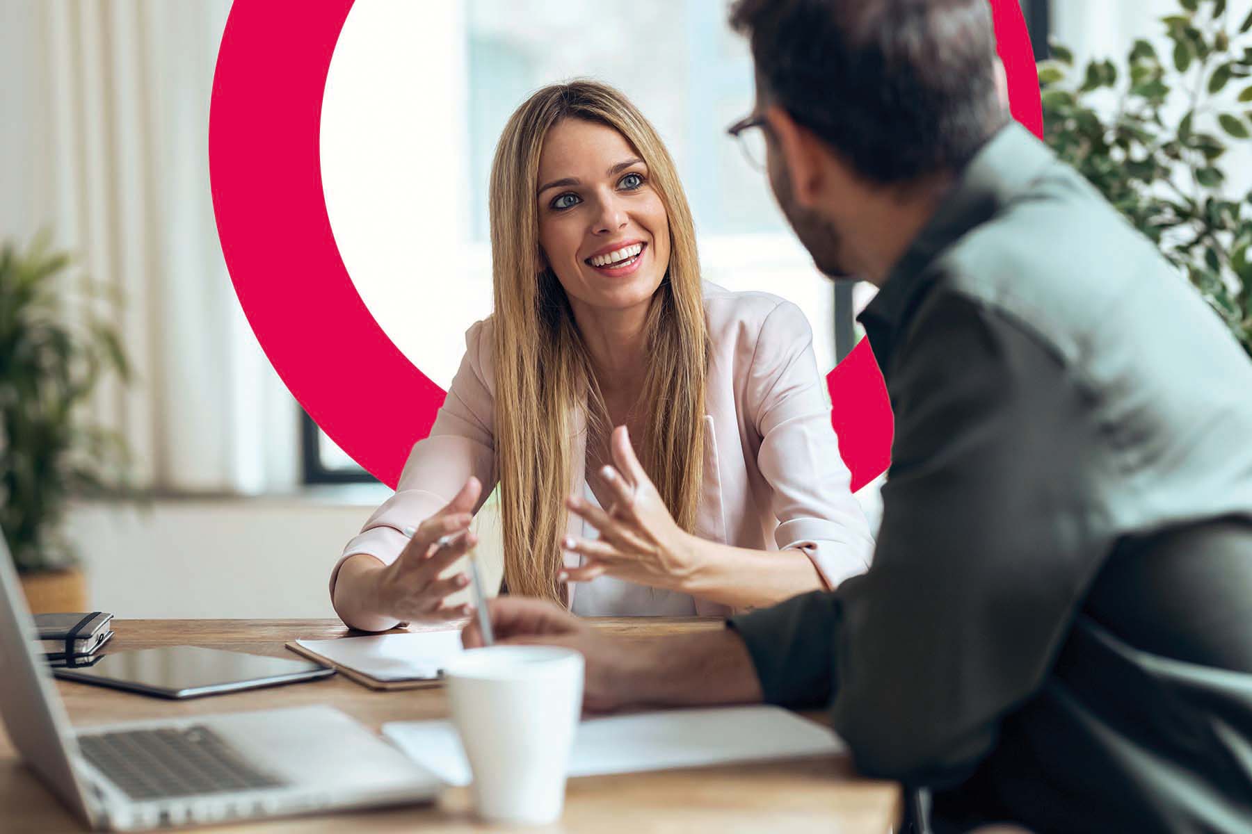 Man and woman discussing in meeting